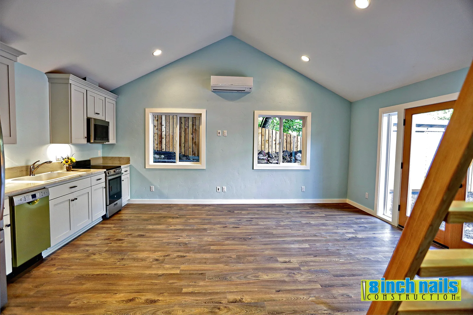 Full ADU kitchen with shaker cabinets, stainless appliances and a ductless mini-split head