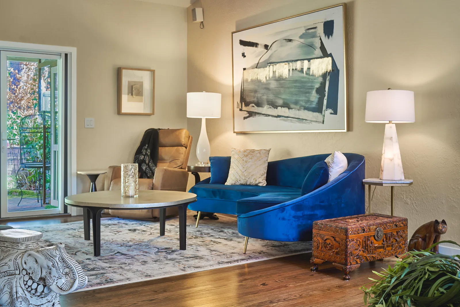 Living room opening onto the brick patio through sliding doors